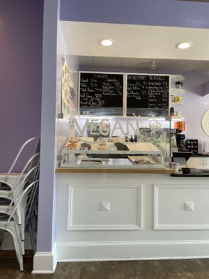 Separate case with the vegan options for donuts, fritters, and cookies  at Sugar Donuts in Charlotte