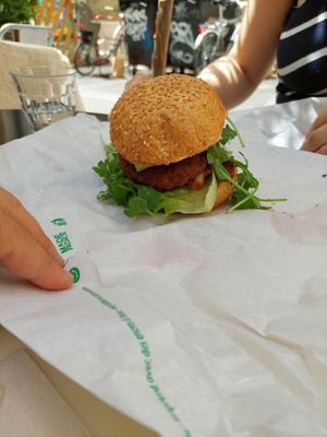 Mexican style vegan burger with salsa, lettuce, avocado and sesame bun. at Peacefood Cafe in Montpellier