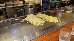 Cooking at the counter at Kurawanka in Miyajima
