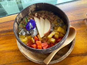 Fruit bowl with coconut water and granola at Jaiyen Resort in Koh Yao Noi