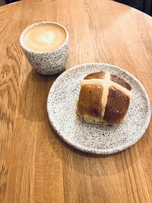 Flat white and warm bun  at STOR - Bracka in Warsaw