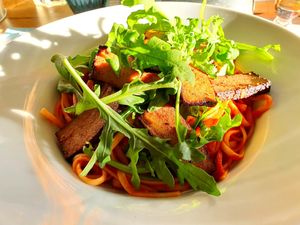 Pasta with tomatoes, rocket and smoked tofu at Hafenliebe in Neuss