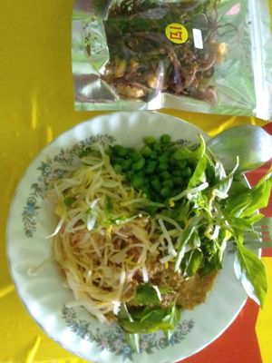 I don't think noodles are always an option, and above the bowl are my favorite mushroom snack of theirs, also not always in stock. at Mueang Daeng Vegan Food - เหมืองแดงอาหารเจ in Mae Sai