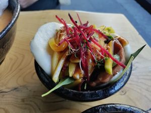 Bao bun with mango and vegan ham at TA Vegan House in Hamburg