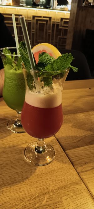 The gin + cucumber and raspberry cocktails. at TA Vegan House in Hamburg