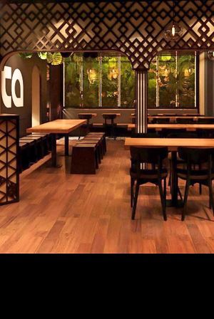 enough space for everyone. Lots of wood, plants and light at TA Vegan House in Hamburg