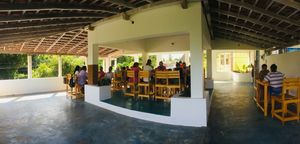 Upstairs, open-air dining  at Yogi's in Auroville