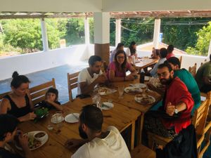 Sadhana Forest Vegan family dining  at Yogi's in Auroville