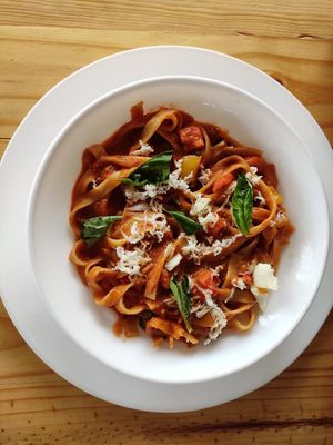 Tagliatelle in Arrabbiata sauce with vegan cheese at Yogi's in Auroville