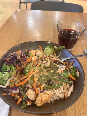 Vegan Thai Bowl and house red winee  at Laughing Planet Cafe - Gabriel Park in Portland