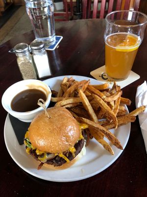 Mushroom burger with plant based cheese side of mushroom gravy!!  at Victoria's Tavern in Regina