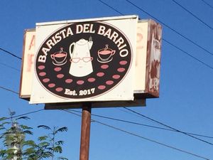Sign facing road at Barista Del Barrio in Tucson