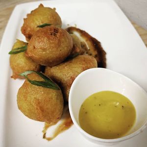 Pholourie (Vegan) - Split pea fritter, tamarind, mango chutney at Oyo in Pleasanton