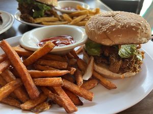 Chikn (fried mushrooms) sandwich & sweet potato fries   at TRI Lounge & Cafe in Staten Island