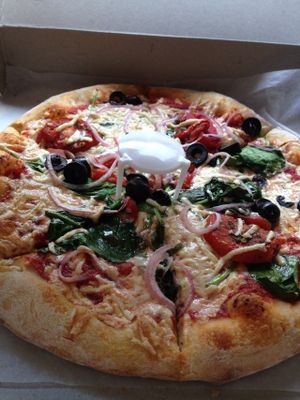 10-inch vegan pizza with vegan cheese, black olives, tomatoes, spinach, and onions at Spak Brothers in Pittsburgh