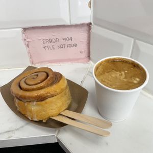 Cinnamon roll and americano  at It's a Trap in Dublin