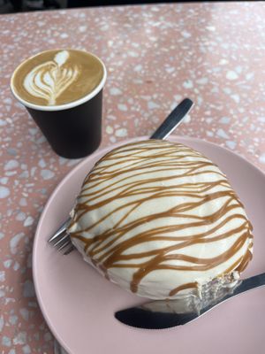 Cream cheese cinnamon roll and flat white  at It's a Trap in Dublin
