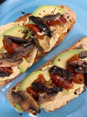 Sourdough Avo, Hummus, oven-roasted tomatoes, added mushrooms at Ethos Brothers in Brentwood