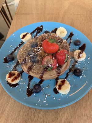 Whole meal pancakes with almond butter and fresh fruit at Ethos Brothers in Brentwood