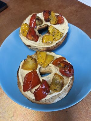 Potato Bagel with Hummus and Peppers at Ethos Brothers in Brentwood