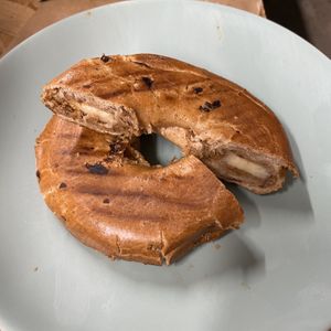 Hot New York Cinnamon Bagel with almond butter and banana   at Ethos Brothers in Brentwood