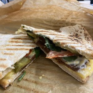 ‘The New Yorker' - American Deli Grilled Flatbread - Vegan Pastrami, Violife Cheese, Gherkin, Tomato, Spinach, Biona Organic Mustard, Vegenaise at Ethos Brothers in Brentwood