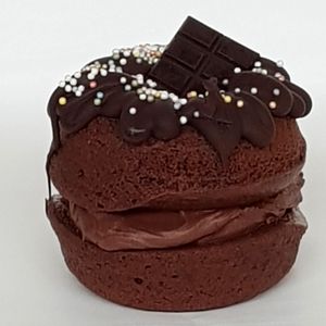 Double chocolate donut doozie with double chocolate donuts and chocolate buttercream topped with chocolate, sprinkles and mini chocolate bar at The Naked Vegan in Cardiff