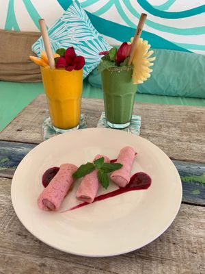 Sweet coconut pancake paired with mango juice and Mangrove smoothie! at Ombak Zero Waste Cafe in Lembongan