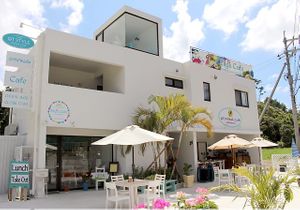 White tropical resort located at the end of a side road along the Route 58. at Elly's Cafe in Onna