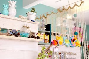 The interior is painted with white with a touch of turquoise green. The bracing atmosphere is also decorated with cute interior accessories. at Elly's Cafe in Onna
