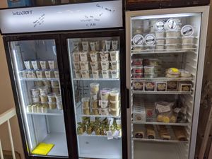 Fridges with cheese at Willicroft - Plant Based Cheese Store in Amsterdam