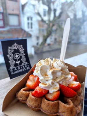 Waffle with whip and strawberries at Otto Waffle Atelier in Bruges