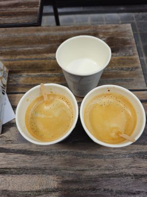 Black Coffee with steamed oat Milk in separate cup at Otto Waffle Atelier in Bruges