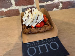 Vegan waffle, strawberry’s, chocolate sauce and whipped cream. WOW  at Otto Waffle Atelier in Bruges