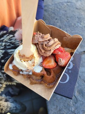 Vanilla ice cream, chokolate mouse, sirup and strawberries on a waffle (all vegan) at Otto Waffle Atelier in Bruges