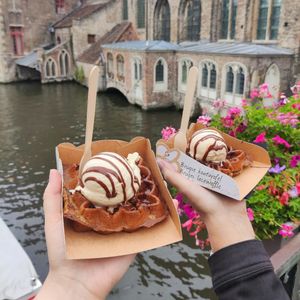 Waffles with vanilla ice-cream and melted chocolate at Otto Waffle Atelier in Bruges