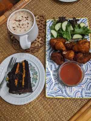 Buffalo cauliflower bites, Chai latte and the richest and silkiest chocolate orange cake ever at Conscious Cow in Worthing