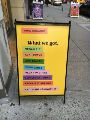 Placard in front of store. at Om Juice Bar in New York City