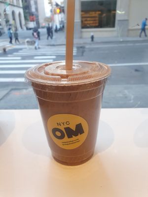 Mint Chocolate Chip smoothie: Banana, Cacao Powder, Chia Seeds, Dates, Mint, Cacao Nibs, Sea Salt, Almond Milk at Om Juice Bar in New York City