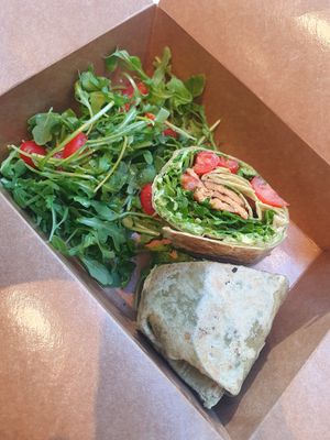 BLT salad wrap: Arugula, Tempeh, Tomatoes & Avocado with side salad at Om Juice Bar in New York City