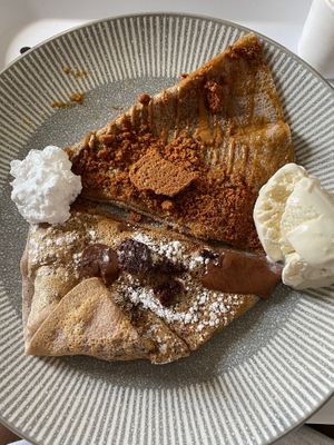 We had half the Lotus & half the Brownie one each! at Crêpeaffaire in Bromley