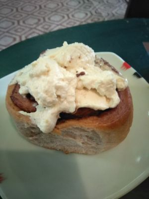 Cinnamon roll with cream cheese on top at Galeria in Hanoi