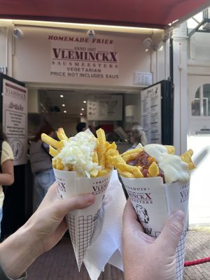 (Left) medium fry with vegan Mayo and onion, (right) medium fry with vegan Mayo and curry ketchup   at Vleminckx Sausmeesters in Amsterdam