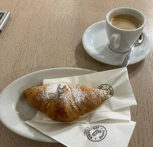 Vegan croissant with apricot filling, caffè crema  at Caffe Spettacolo - Wiedikon in Zurich