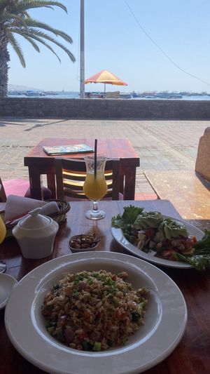 Fried rice, veggies with avocado, orange juice   at Karamba Restobar  in Paracas