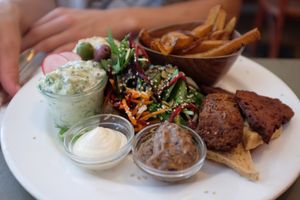 plate with dips, salad, falafel and fries at Cafe N in Copenhagen