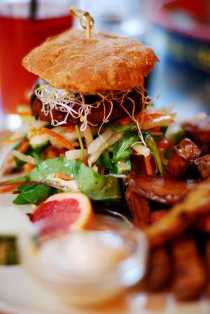 Veggie burger with root fries, vegan mayo and fresh juice at Cafe N in Copenhagen