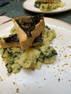 This was amazing their take on traditional portiguese Boneless Lagareiro - Marinated organic tofu with garlic sauteed cabbage sprouts and roughly mashed potatoes! at The Green Affair - Chiado in Lisbon