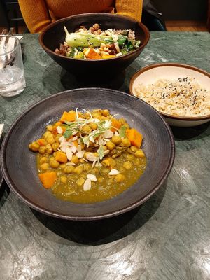 Main dishes of the lunch deal. Green curry with chickpeas and pumpkin. Served with rice. The other dish is a Buddha bowl. The curry was decent, but misses the kick of a real curry. at The Green Affair - Chiado in Lisbon