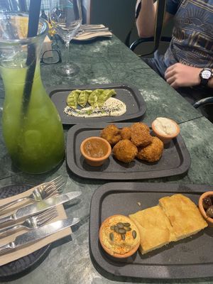 starters and green sangria - gyozas, fried cauliflower (OMG the cheese dip!!!), and breads  at The Green Affair - Chiado in Lisbon
